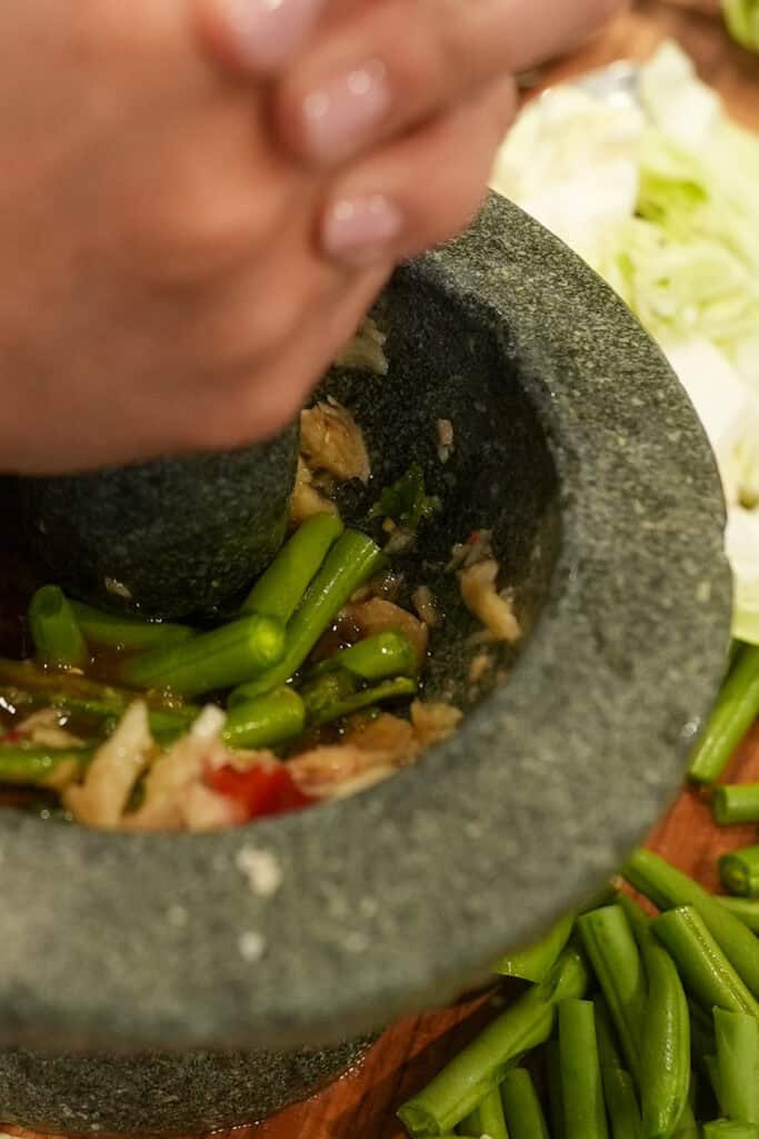 mortar and pestle with green beans