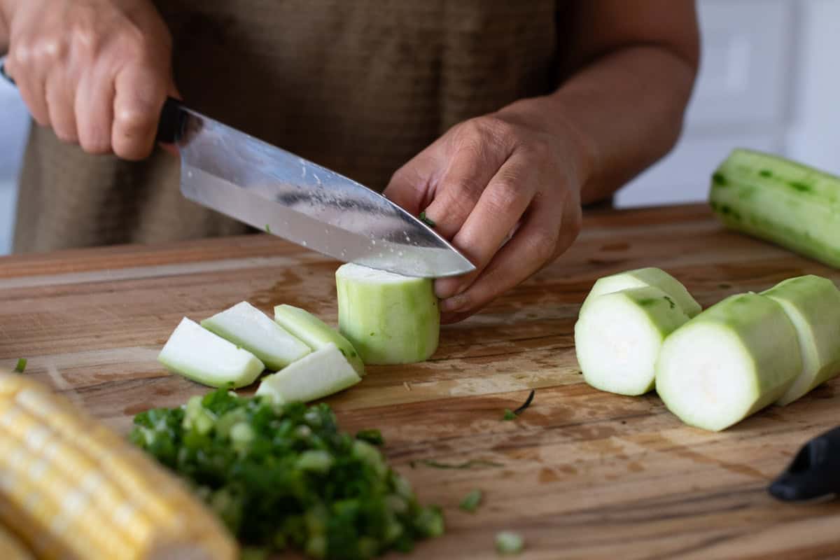 Chopping okra into 1inch lengths and then cutting in quarters